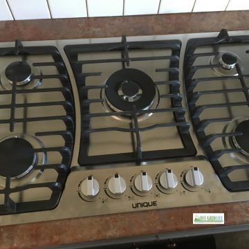 Unique brand five-burner propane cooktop.