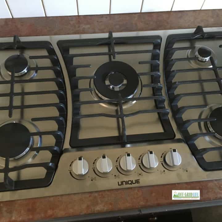 Unique brand five-burner propane cooktop.