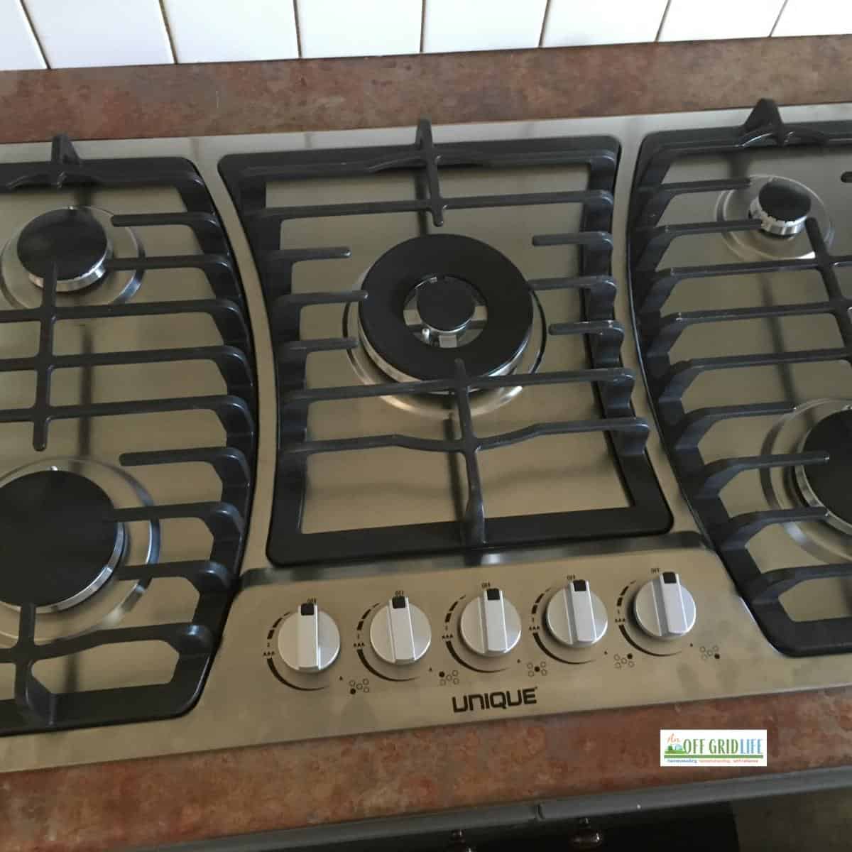 Unique brand five-burner propane cooktop.