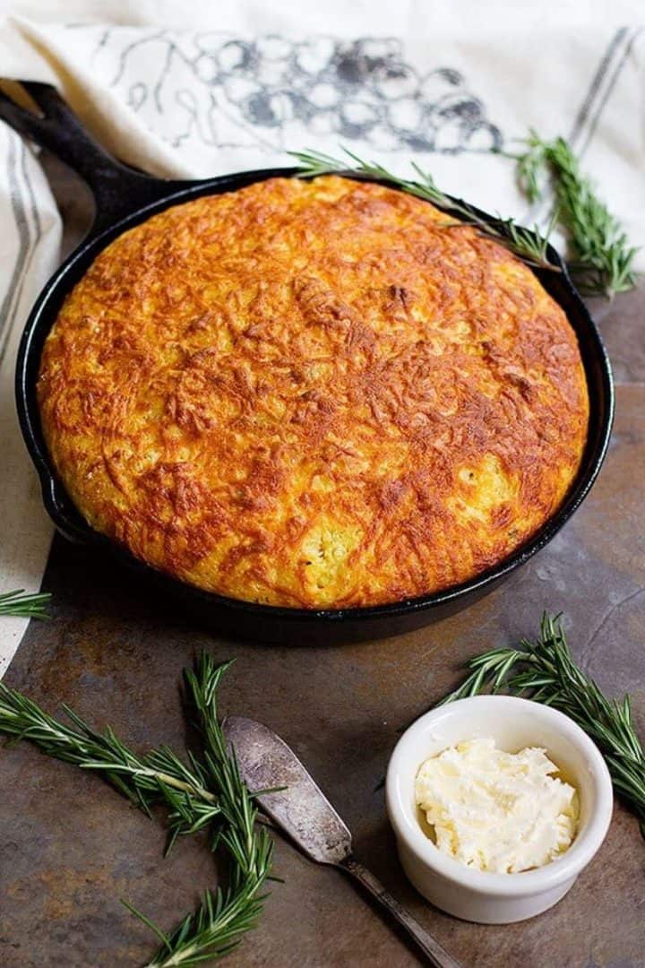 rosemary cheddar cornbread in cast iron pan