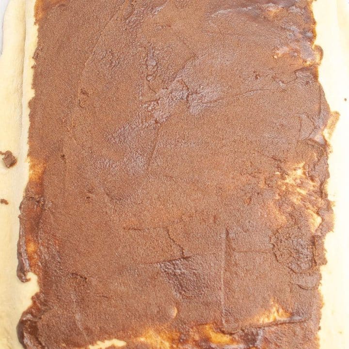 Freshly baked rectangular chocolate brownie with a cracked surface.