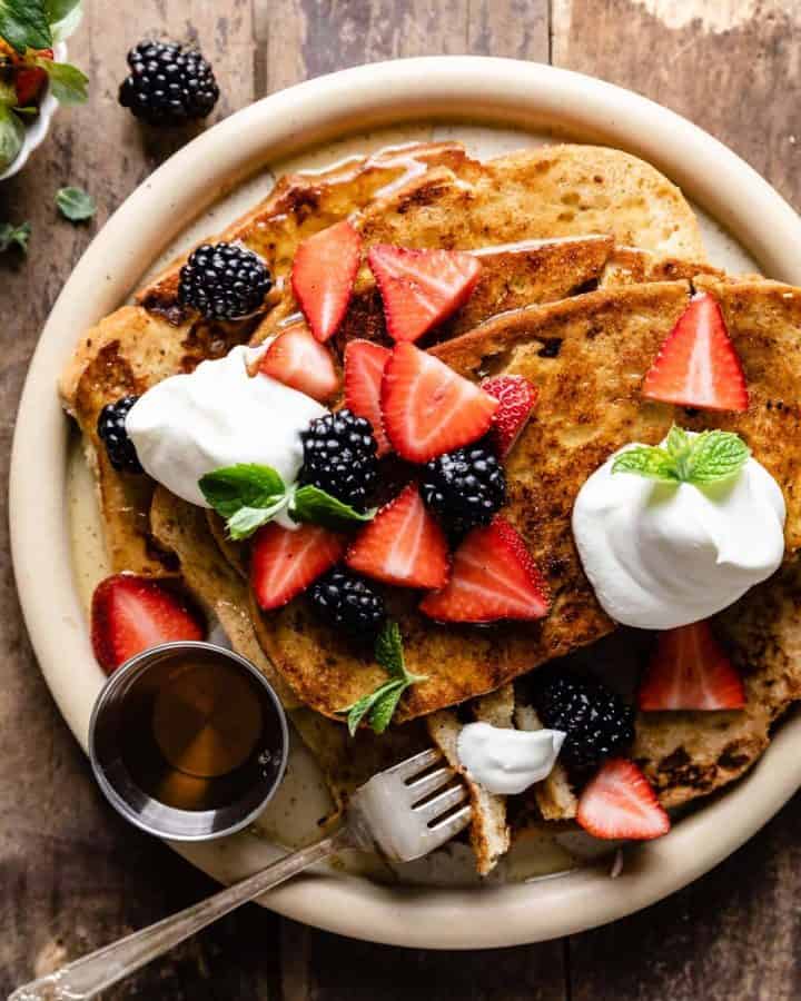 sourdough french toast with whipped cream and berries