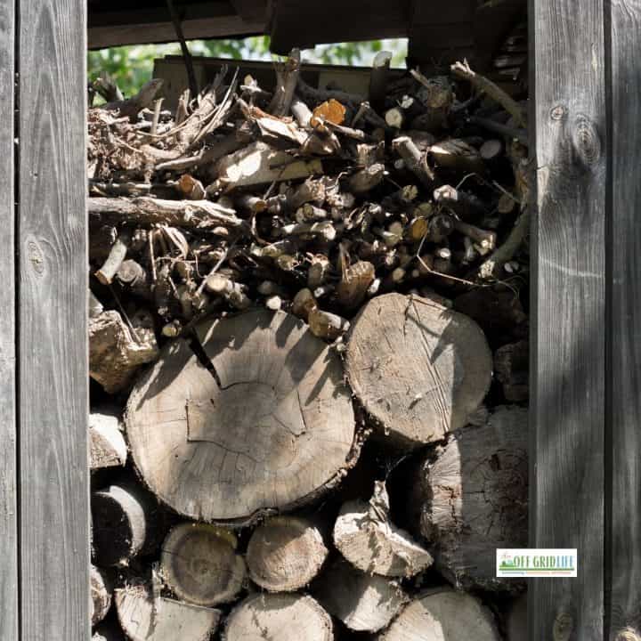 Wood stacked against wood pallets.